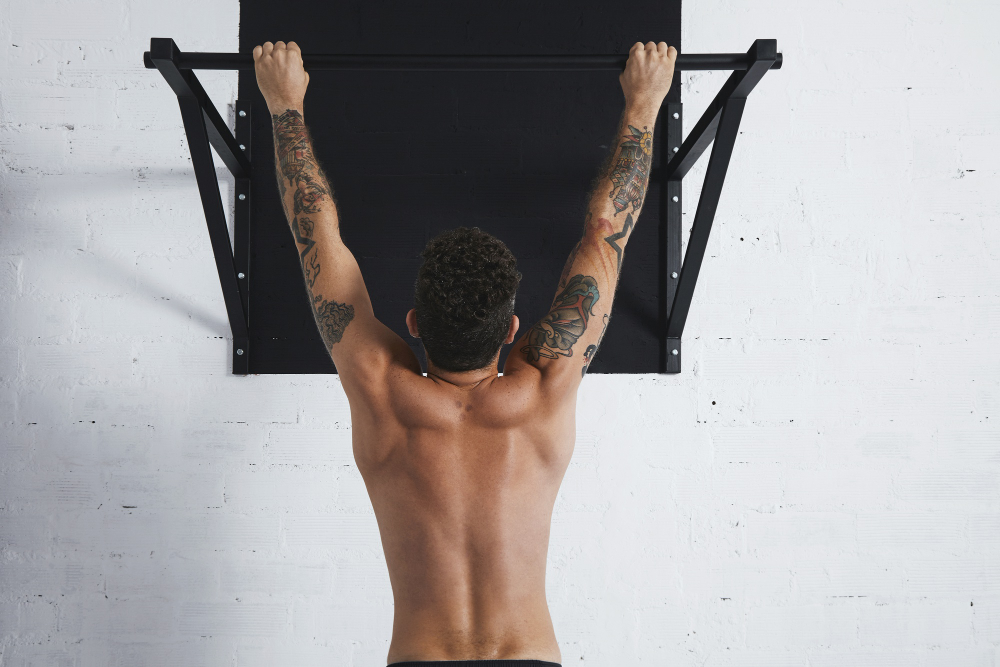 A Man Doing Pull Ups With Pull Up Bar (Home Gym Equipment)
