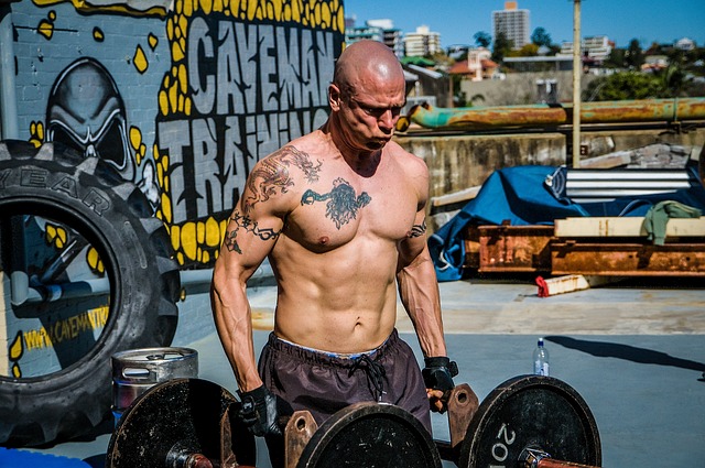 A Man Doing Farmer's Carry To Increase Grip Strength