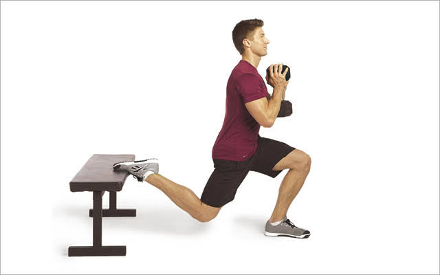 A Man Doing Weighted Bulgarian Split Squats