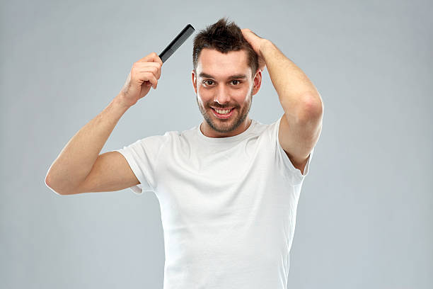 a man fixing his hair grooming essentials for men