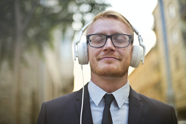 A Man Listening To Music While On His Way To Work