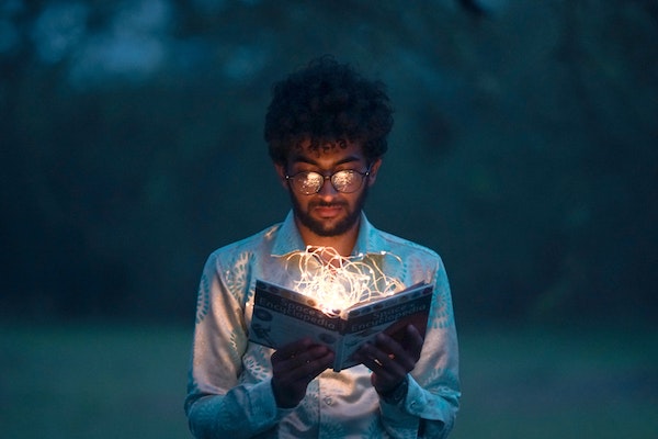 A Man Reading A Book