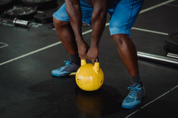 A Man Doing Kettlebell Exercise For Stronger Grip