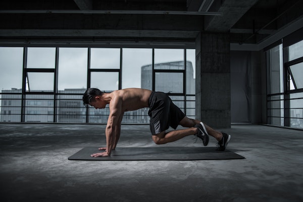 A Man Doing Plank Mountain Climbers