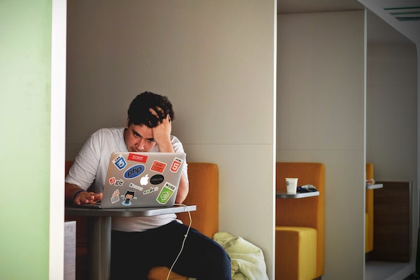 A Guy Being Stress On Work