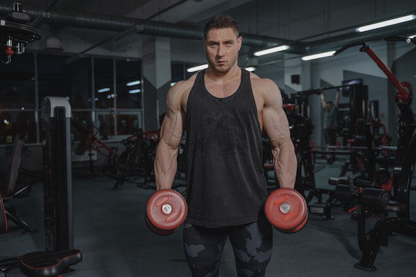 A Man Holding Dumbbells