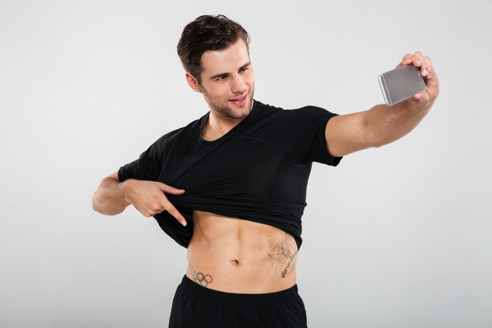 A Man Flexing His Abs