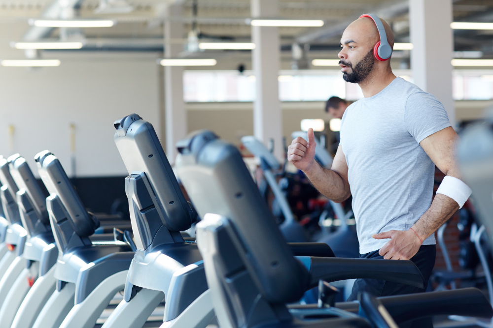 A Man Using Treadmill On A Gym