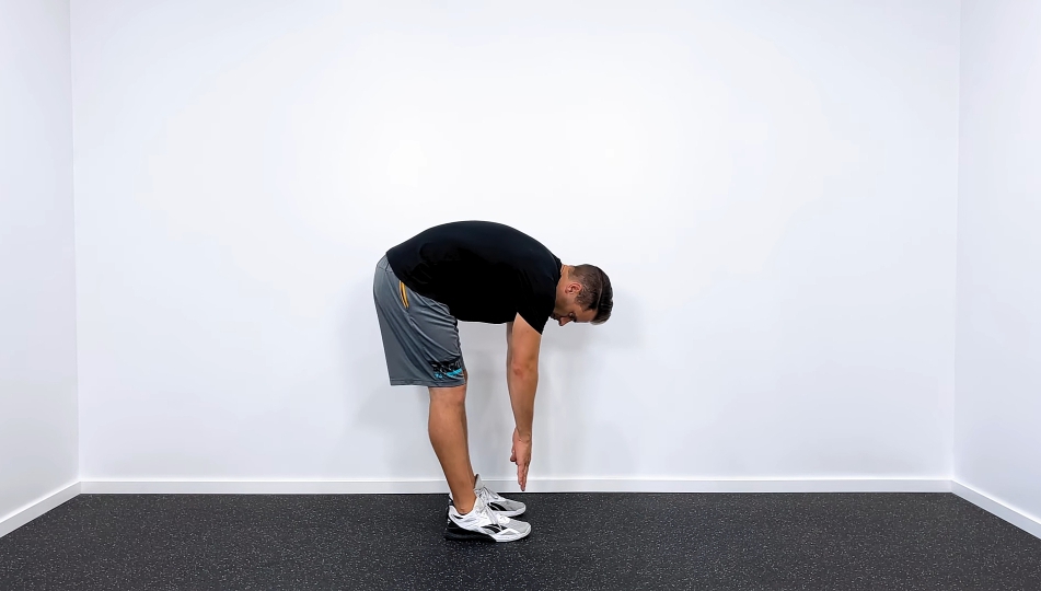 A Man Doing Hamstring Stretching Exercises