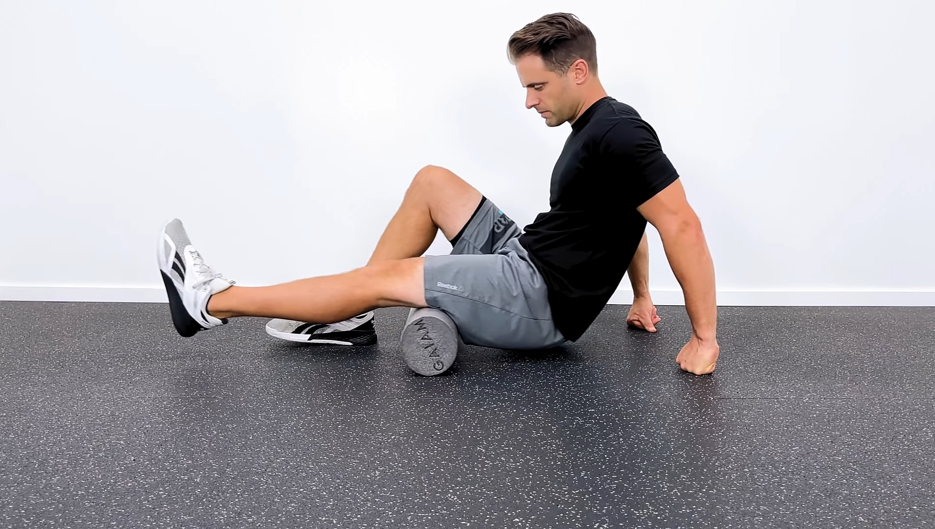 A Man Doing Hamstring Stretching Exercises
