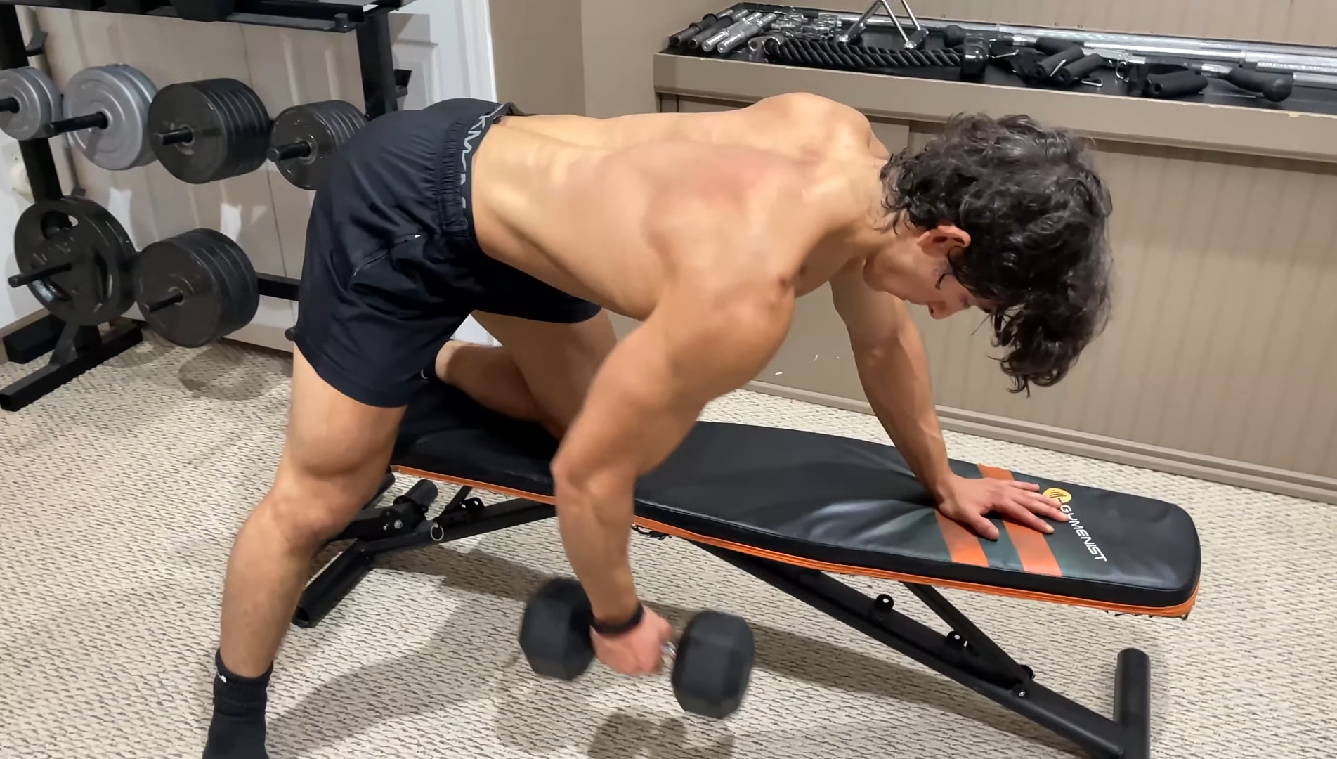A Man Doing Single-Arm Dumbbell Rows