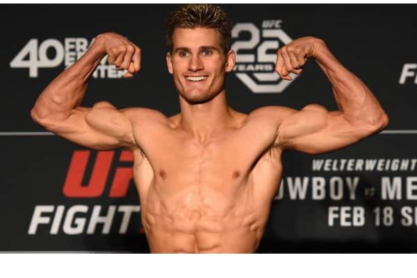 Sage Northcutt flexing his muscles. Read more to find out how you can too be ripped.