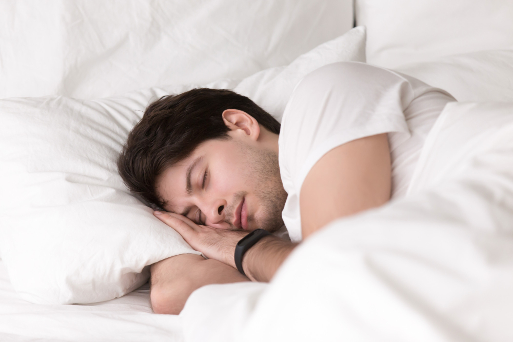 A Man Sleeping On His Bed