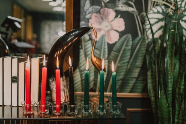 lighted candles on glass candle holder